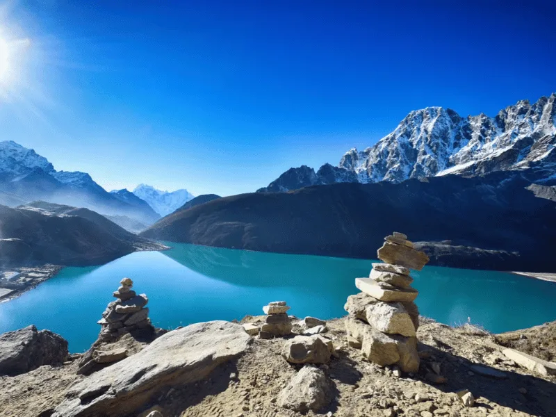 Helicopter flying over the turquoise Gokyo Lakes with Everest in the background